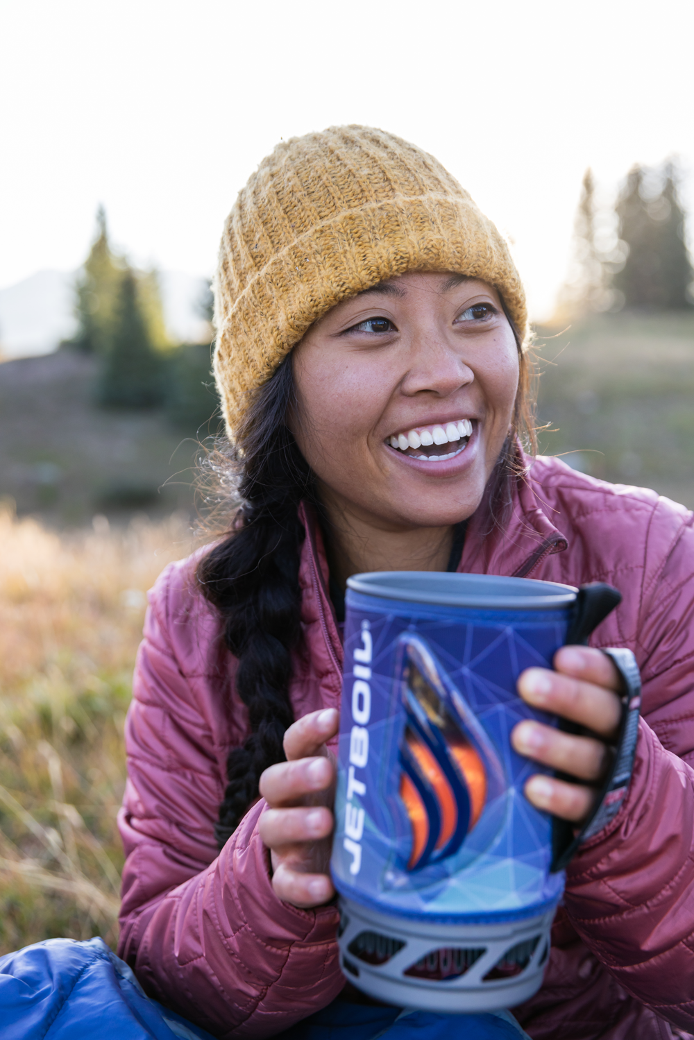 Woman eating food out of JetBoil