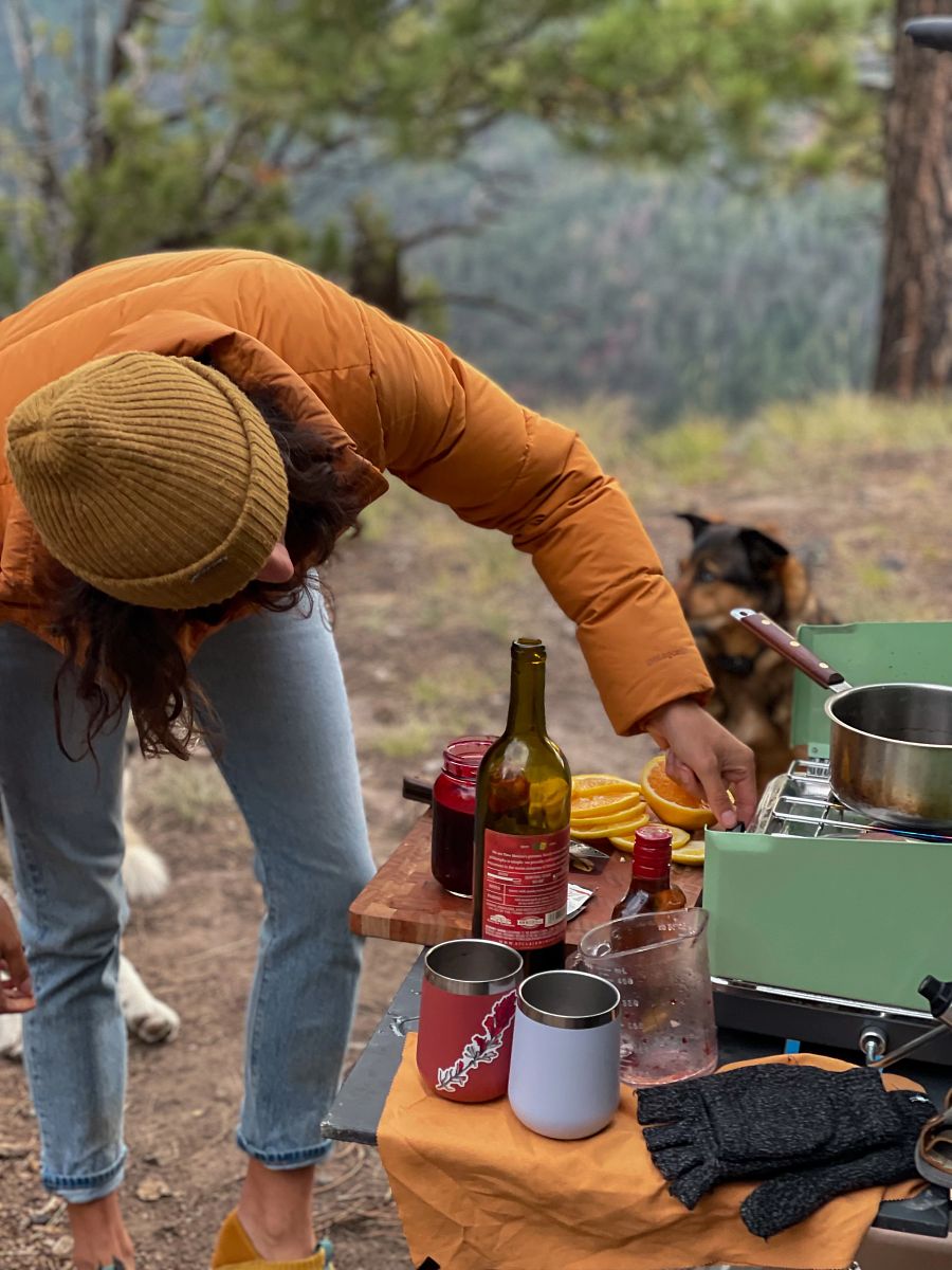 Woman using camp stove