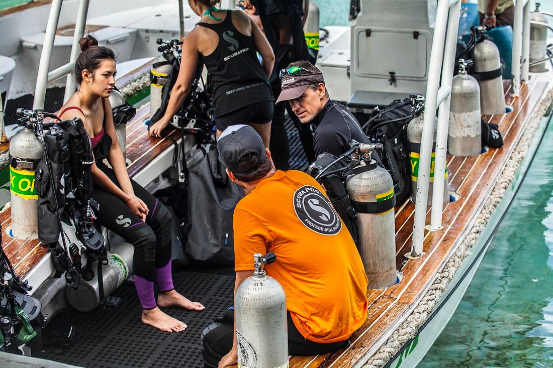 A group of SCUBA divers on dive boat