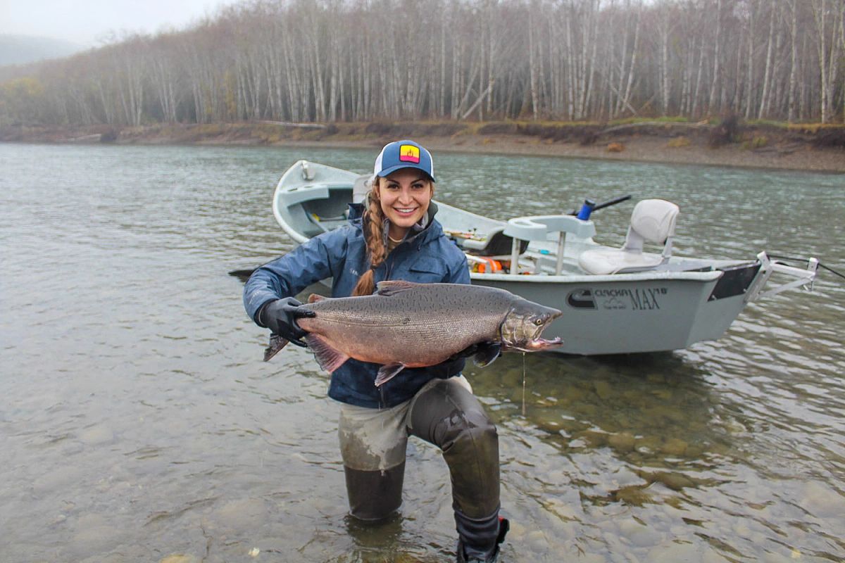 Girl holding fish in water