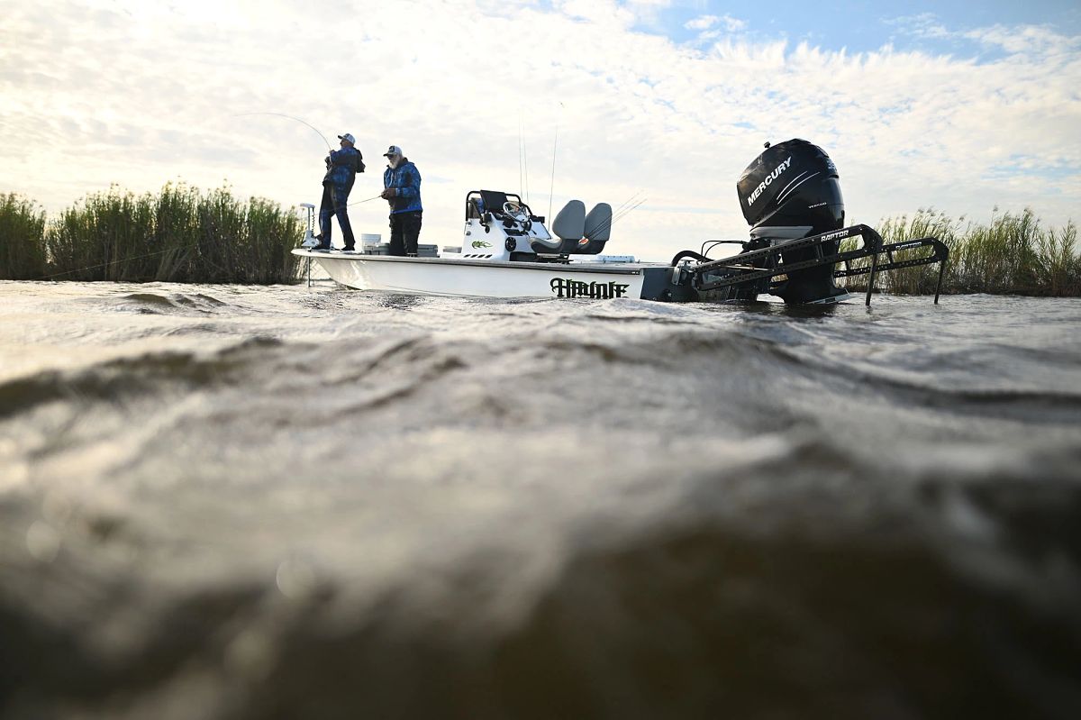 Angler Cajun Phil with partner fishing off boat
